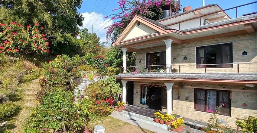 The Tushita-Nepal retreat house, framed by flowering bougainvillea